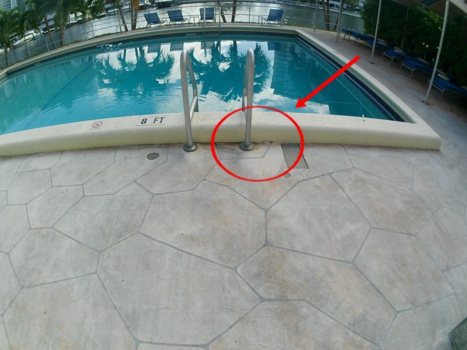 Commercial pool deck marked at the area of the gutter line break